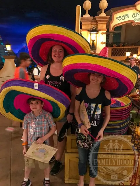 Kids trying on sombreros in Mexico Pavilion Epcot World Showcase