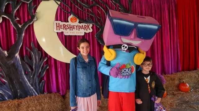 Bella and Jackson meeting Jolly Rancher character at Hersheypark in the Dark
