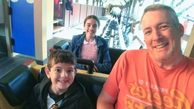 James and the kids on a roller coaster at Hersheypark